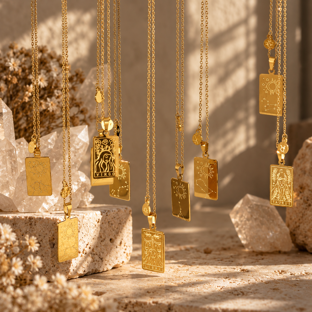 Gold zodiac pendant necklaces displayed together - Let's Jam zodiac & astrology collection, Camden Market