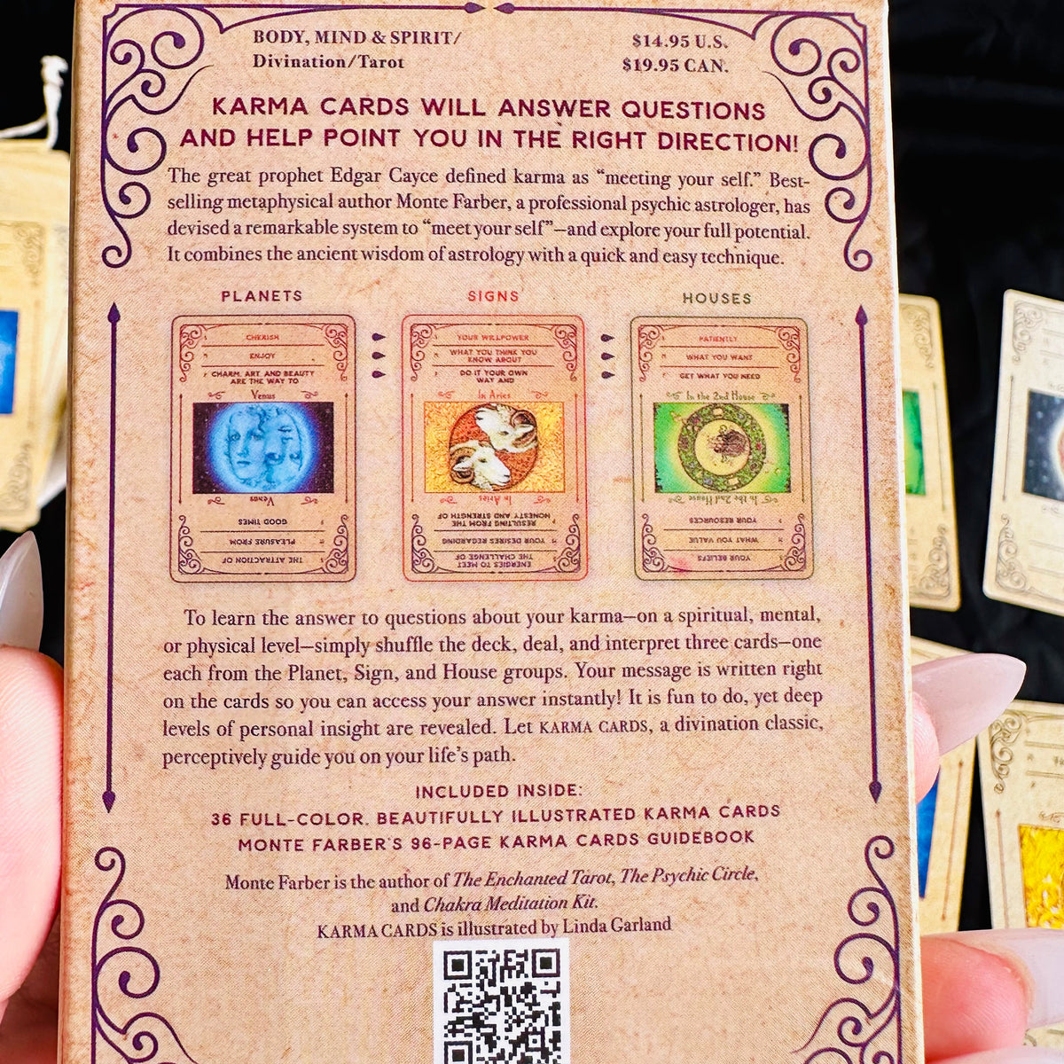 Astrology oracle cards laid out on black fabric beside the box - Let's Jam tarot and oracle, Camden Market, London