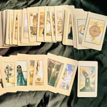 Load image into Gallery viewer, Cream Lucid Dreams cards laid out in front of houseplants - Let's Jam tarot and oracle, Camden Market, London