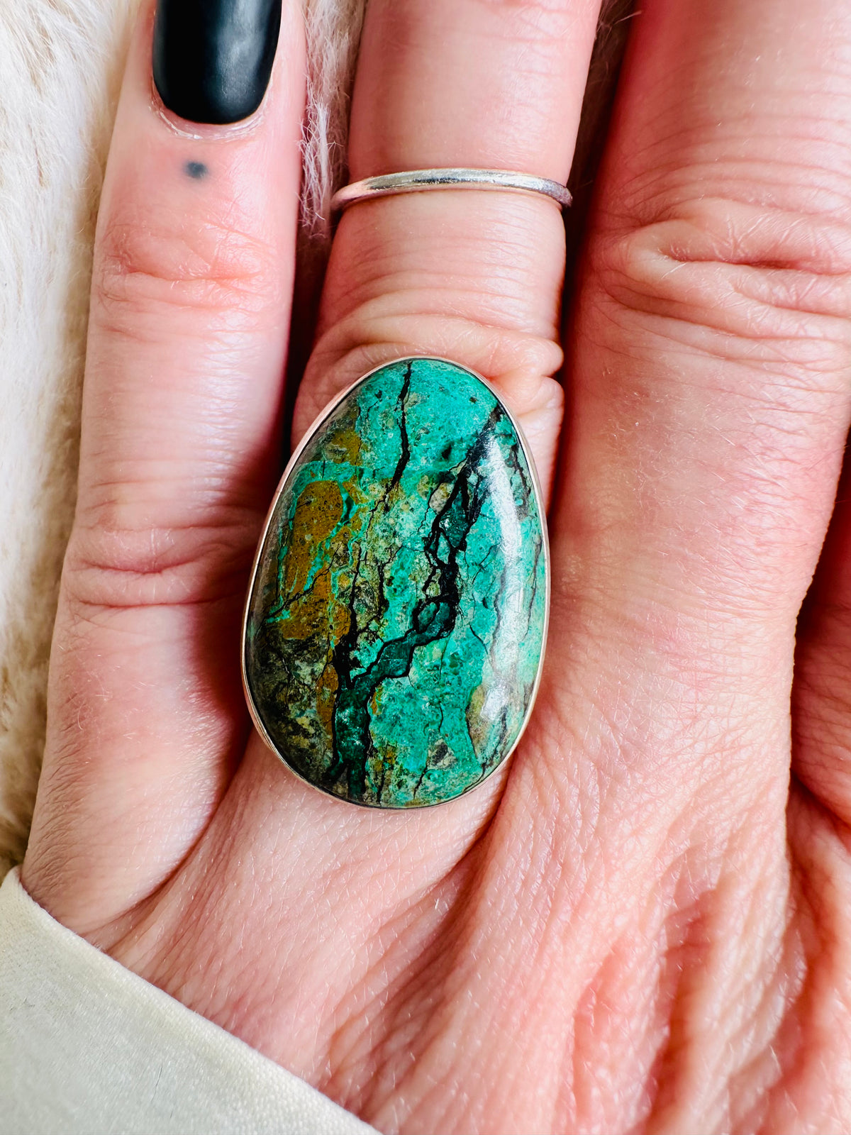 Teardrop-shaped malachite cabochon ring with dramatic green and black banded patterns, set in a sterling silver band - Let's Jam jewellery collection