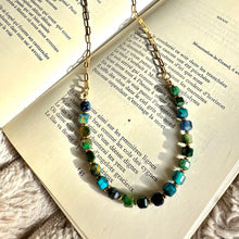Load image into Gallery viewer, Polished blue stone beads shown against soft neutral fabric - Let's Jam jewellery, Camden Town