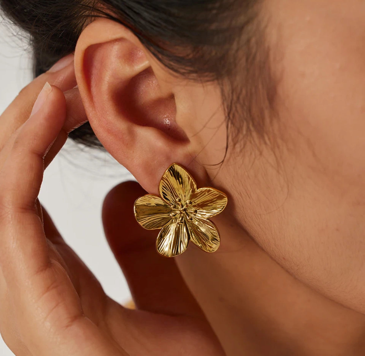 Close-up of the petal texture on a single flora stud earring - Let's Jam, Camden Town