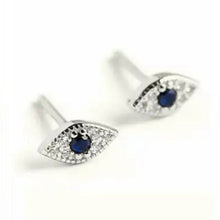 Load image into Gallery viewer, Close-up of the small round eye stud worn in the upper ear - Let's Jam jewellery, Camden Market, London