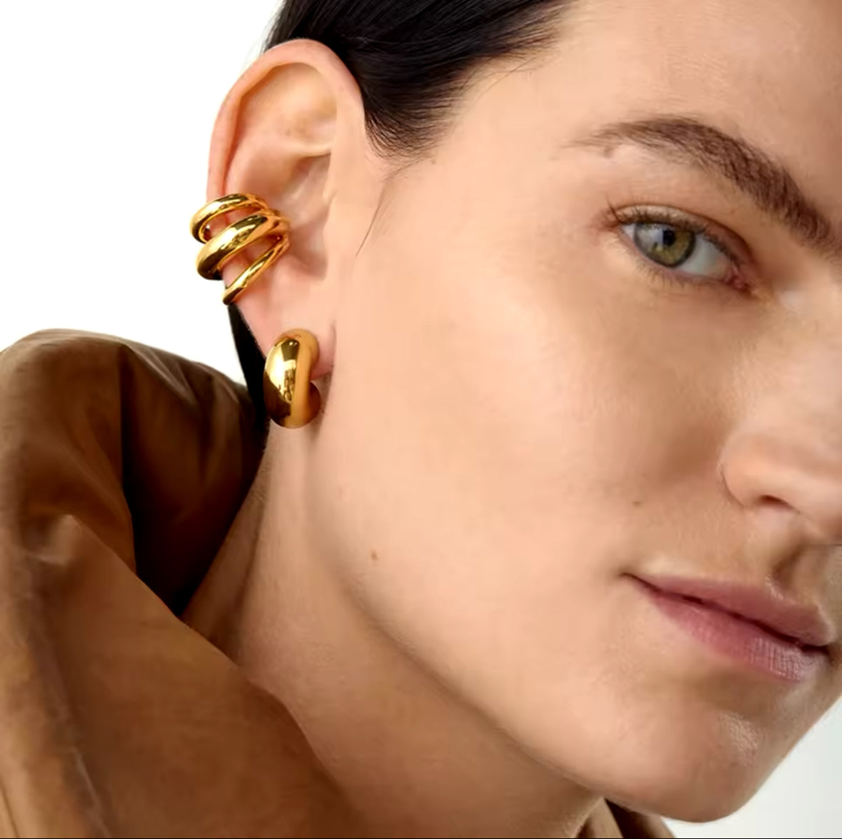 Model wearing a gold-tone 3-layer stainless steel ear cuff, no piercing needed - Let's Jam jewellery collection