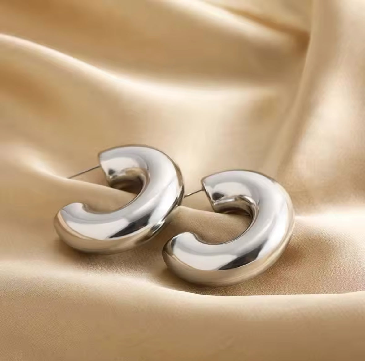 Gold and silver ear cuff and earring sets displayed side by side - Let's Jam jewellery, Camden Market London