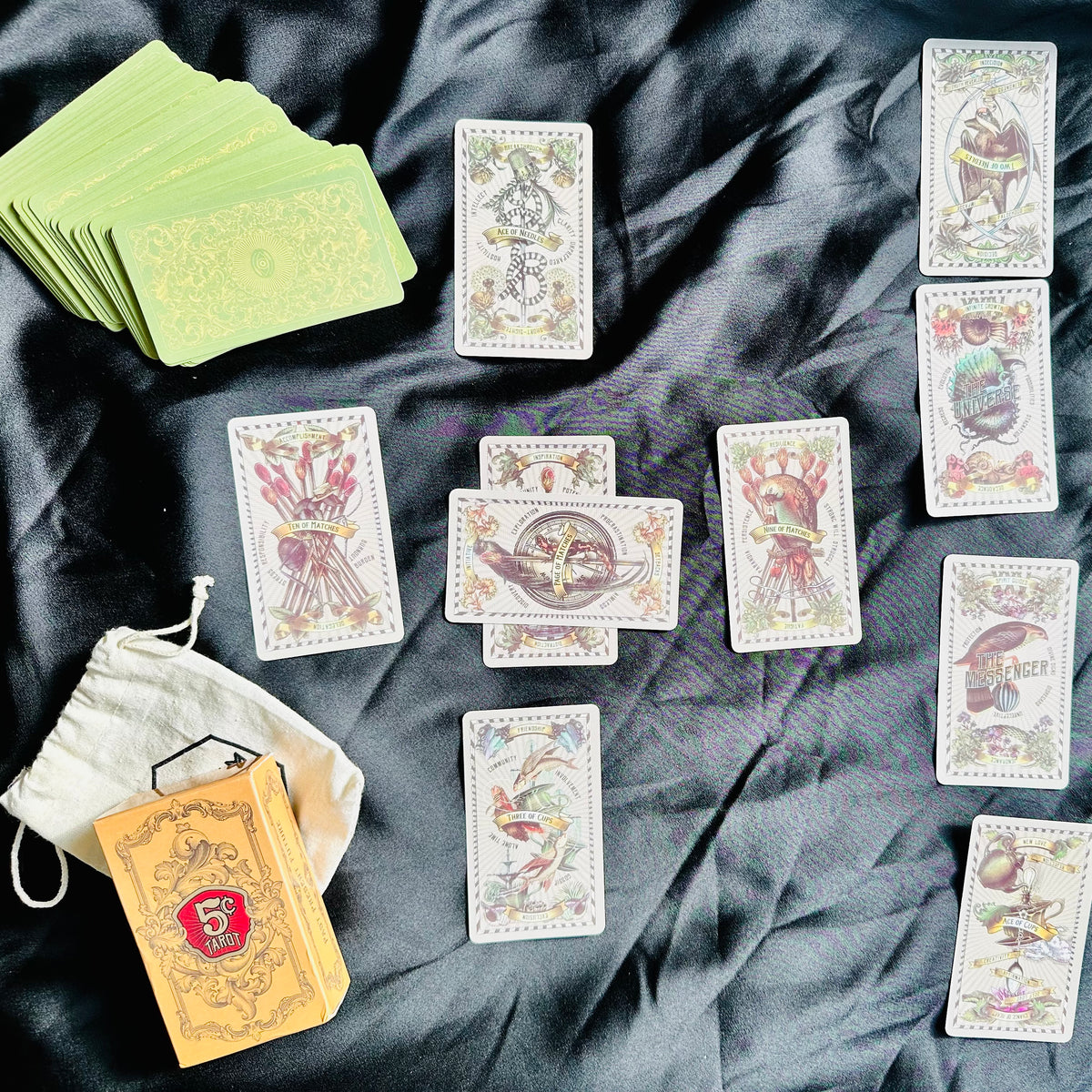 Close view of a 5 Cent Tarot card in vintage scientific illustration style - Let's Jam tarot and oracle, Camden Market London