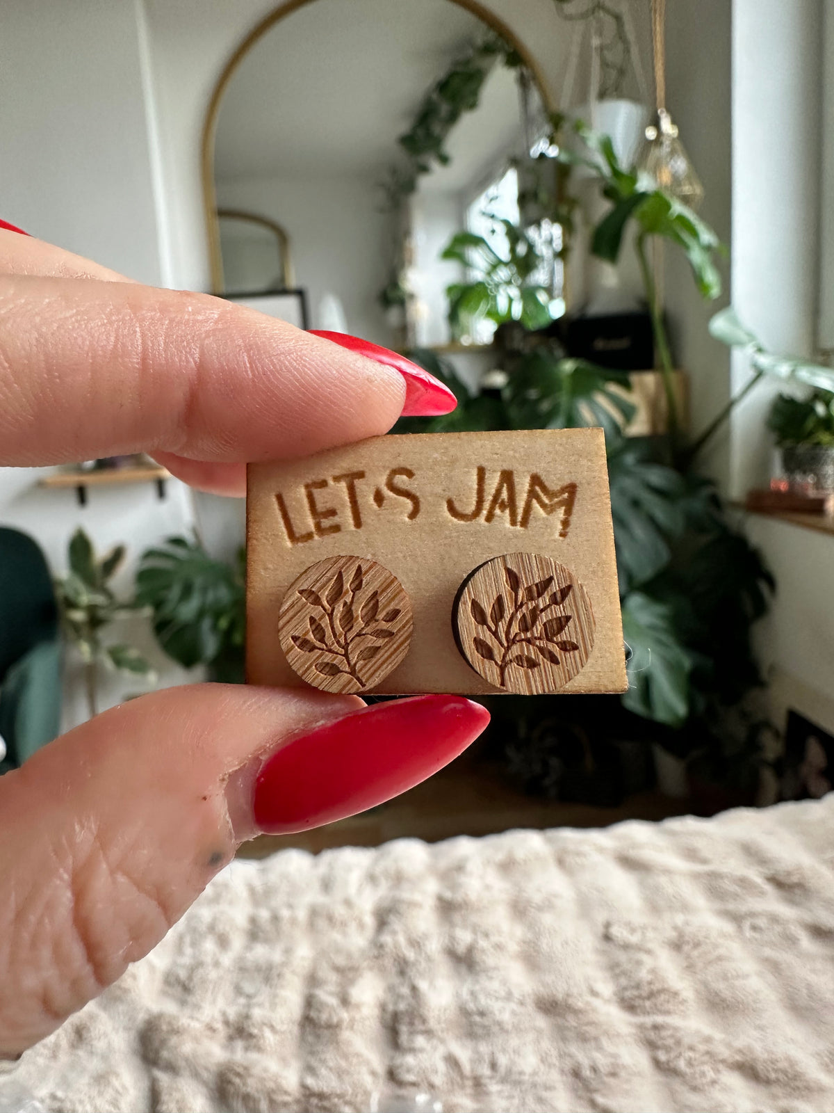 Round wooden stud earrings engraved with a large leaf motif - Let's Jam jewellery, Camden Market, London