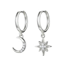 Load image into Gallery viewer, Pair of silver-plated hoop earrings with dangling charms, a crescent moon and an eight-point star, both set with zirconia stones, on a white background - Let's Jam jewellery collection
