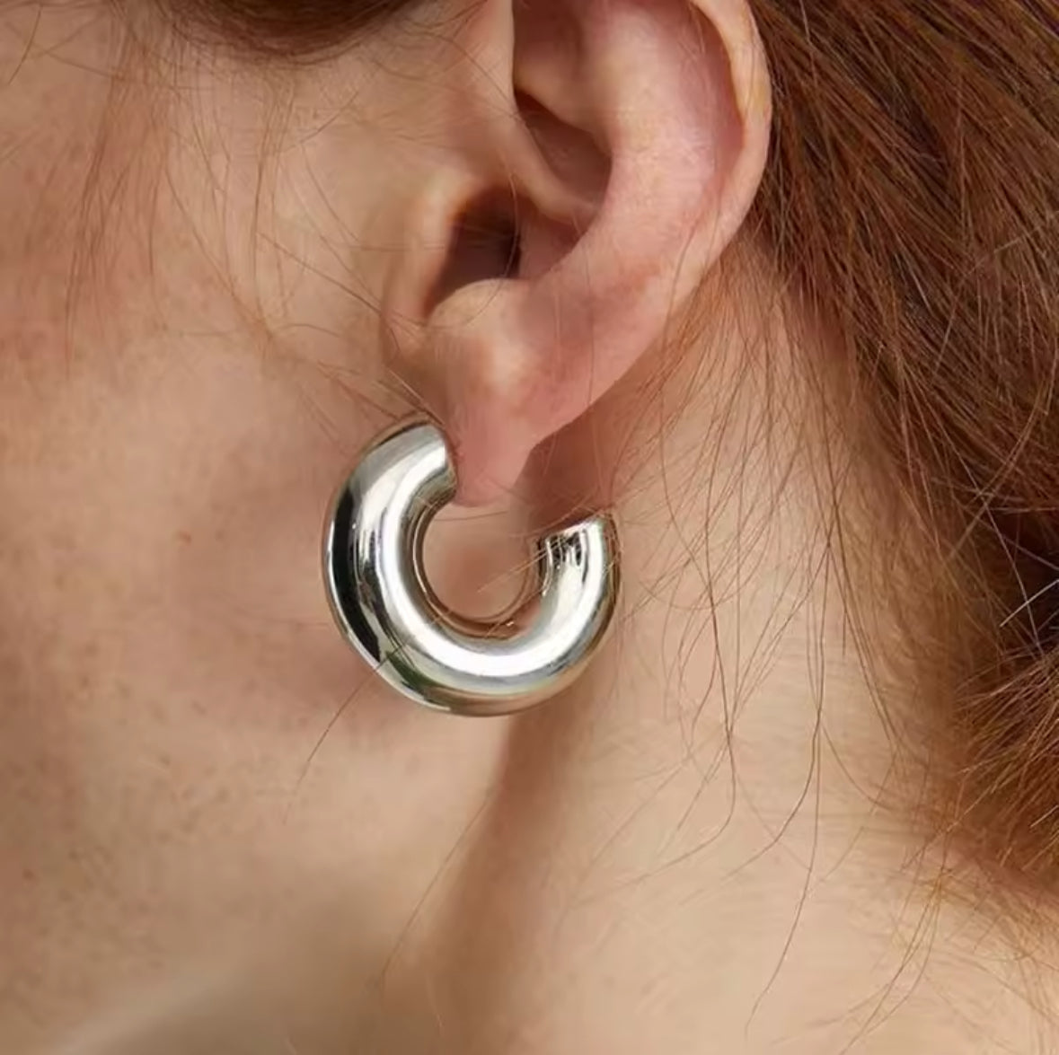 Model wearing the silver cuff and hoop earring combination, hair tucked back - Let's Jam jewellery, Camden Market