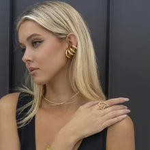Load image into Gallery viewer, Gold four-layer ear cuff shown on the ear from the front - Let's Jam, Camden Market London