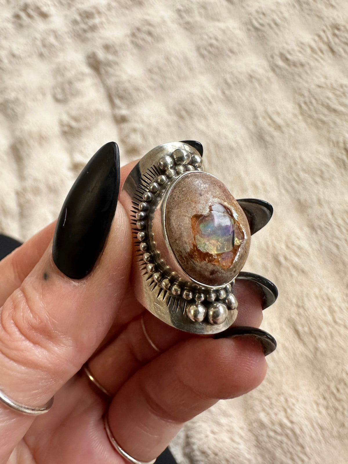 Handmade 925 sterling silver ring with an oval Mexican opal showing a flash of blue-green fire, elaborate beaded and fluted silver bezel, one-of-a-kind gemstone ring - Let's Jam jewellery collection