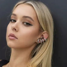 Load image into Gallery viewer, Model wearing a silver 4-layer multi-loop ear cuff, no piercing needed - Let's Jam jewellery collection