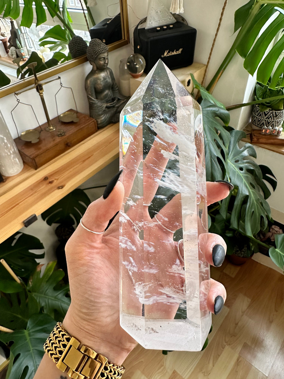 Wide clear quartz tower with feather-like inclusions inside the stone - Let's Jam crystal shop, Camden Market