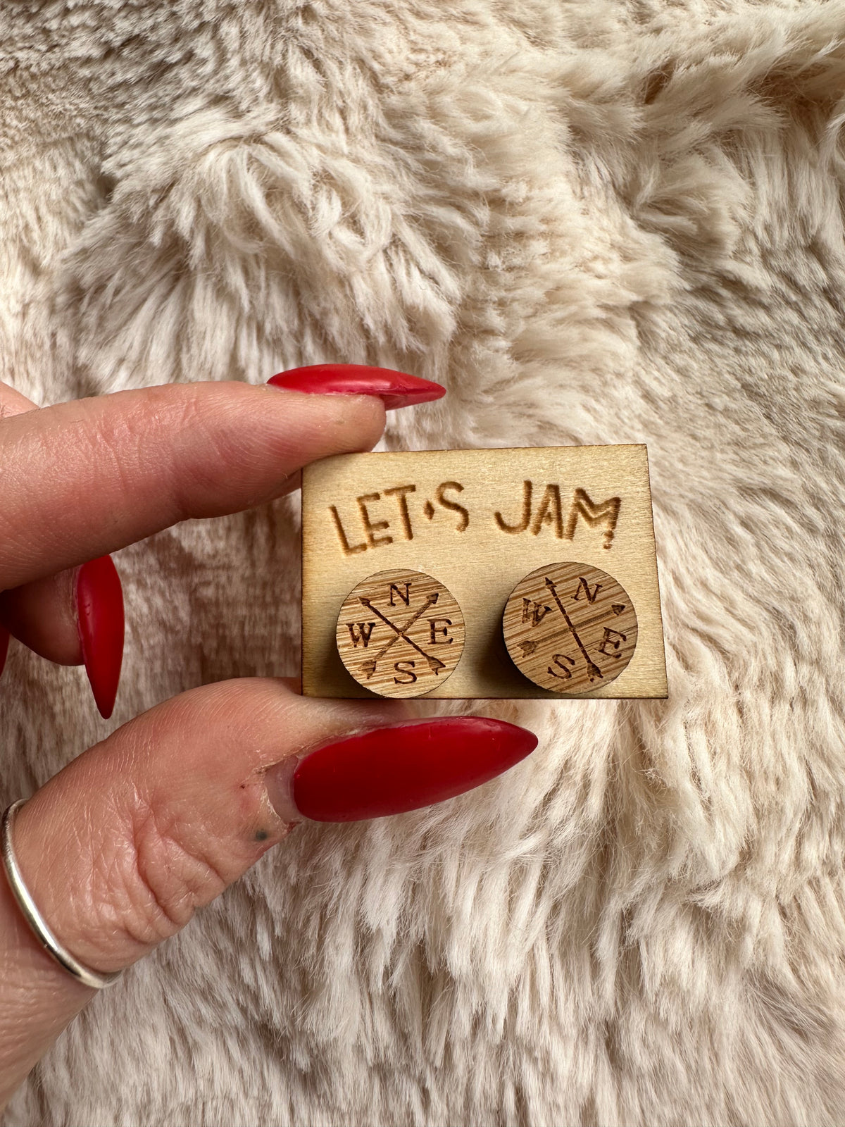Detail of the compass points etched into pale wooden studs - Let's Jam, Camden Town London