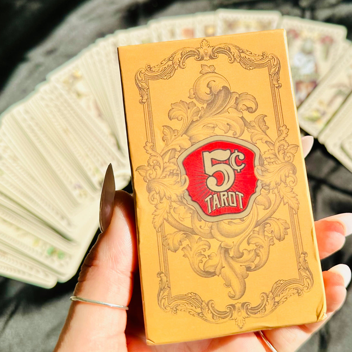 Cream and black 5 Cent Tarot cards spread across a flat surface - Let's Jam, Camden Market London