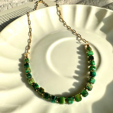 Load image into Gallery viewer, Green tiger's eye beaded choker necklace with 18k gold-plated stainless steel chain, displayed on a white plate - Let's Jam jewellery collection