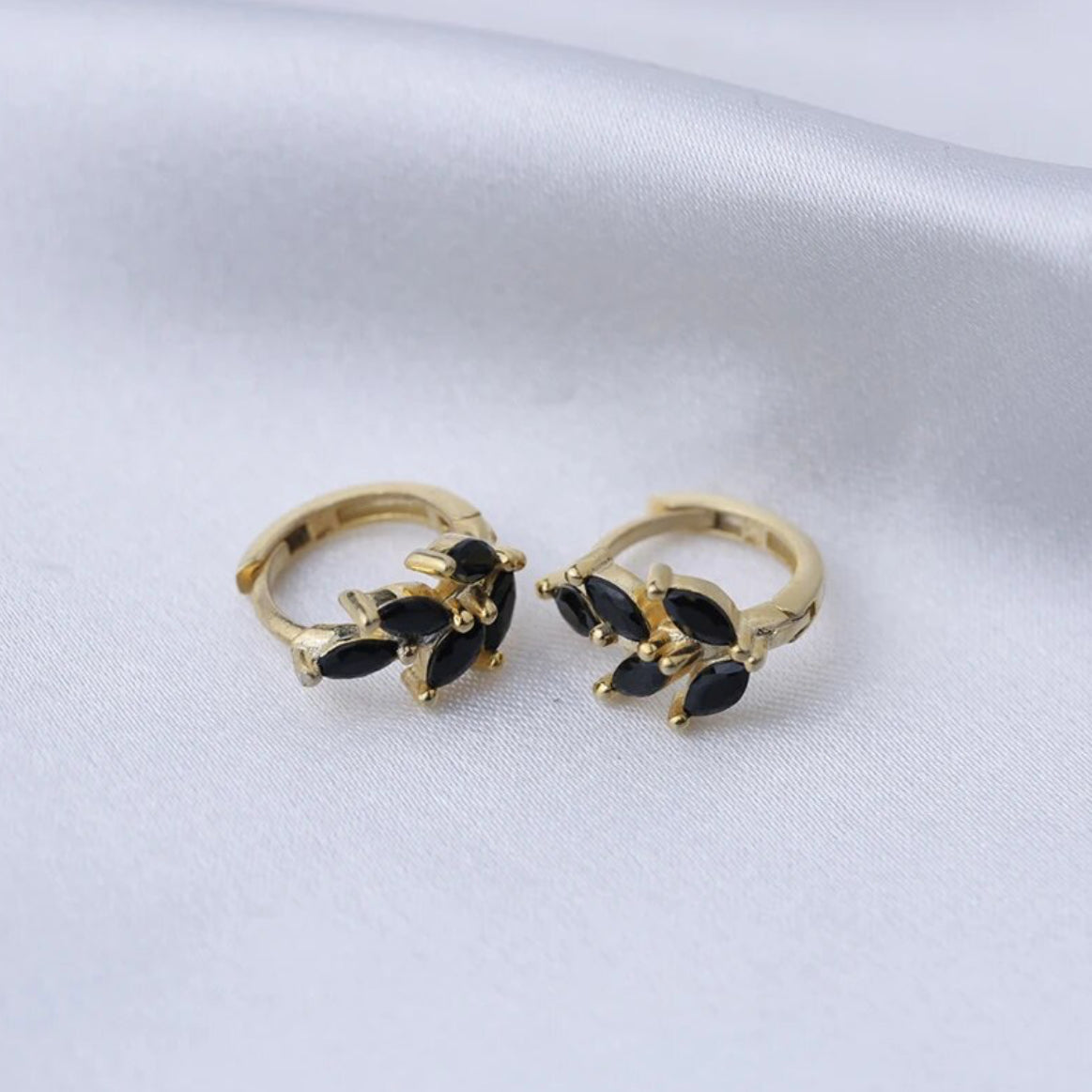 Close view of the dark stones clustered along the leaf-shaped hoop earring - Let's Jam jewellery, Camden Town
