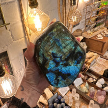 Load image into Gallery viewer, Polished labradorite freeform turned towards the light to show its blue and gold flash - Let's Jam, Camden Market London