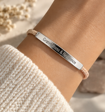 Load image into Gallery viewer, Pink cord bracelet with a silver Gratitude and Resilience bar, worn on the wrist - Let's Jam jewellery, Camden Market