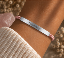 Load image into Gallery viewer, Silver I Am Enough bar with a pale pink beaded cord, worn on the wrist - Let's Jam, Camden Market London