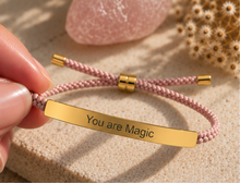 Load image into Gallery viewer, Pink braided bracelet with a gold You Are Magic plate and sliding fastenings - Let's Jam, Camden Town London