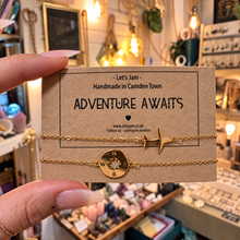 Load image into Gallery viewer, Adventure Awaits matching bracelets with a plane and compass charm on their gift card - Let's Jam, Camden Market London