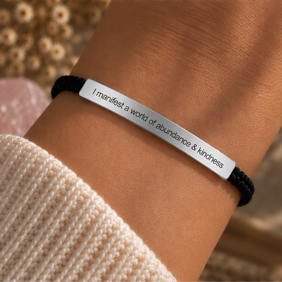 Silver engraved bar on a black cord bracelet worn on the wrist - Let's Jam, Camden Market