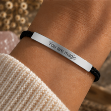 Load image into Gallery viewer, Black cord bracelet with a silver You Are Magic bar worn on the wrist - Let's Jam jewellery, Camden Market, London