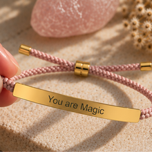 Load image into Gallery viewer, Pink braided bracelet with a gold You Are Magic plate and sliding fastenings - Let's Jam, Camden Town London
