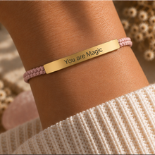 Load image into Gallery viewer, Pink braided cord bracelet with a gold You Are Magic bar, worn on the wrist - Let's Jam jewellery, Camden Market
