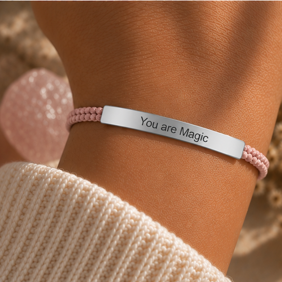 Pink cord bracelet with a silver You Are Magic bar and a rose quartz behind - Let's Jam, Camden Town