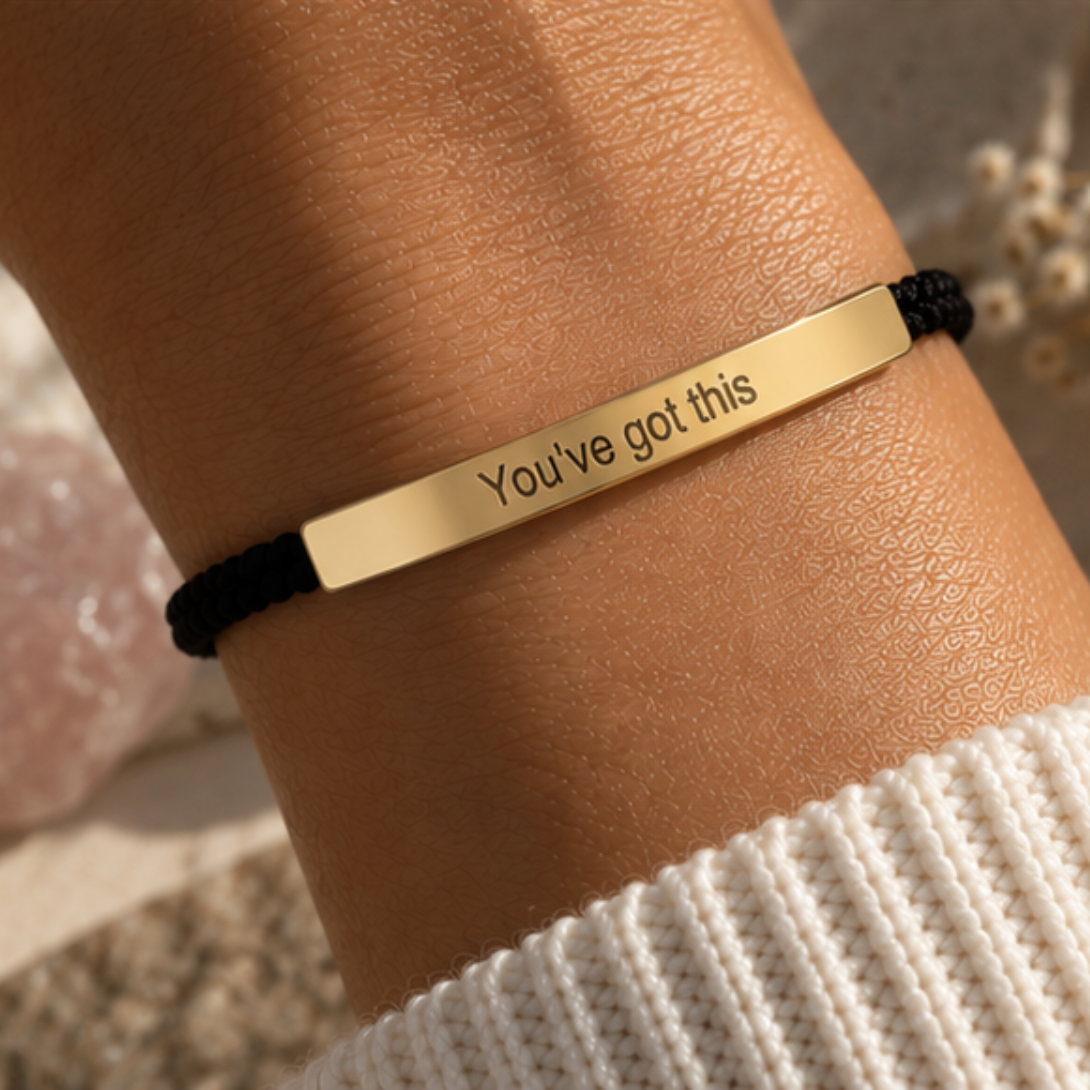 Gold You've Got This bar on a black cord bracelet, worn on the wrist - Let's Jam jewellery, Camden Town