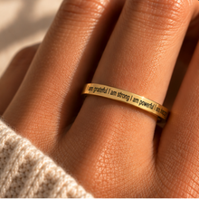 Load image into Gallery viewer, Hand wearing the gold 'I am grateful I am strong I am powerful I am happy' ring - Let's Jam, Camden Market London