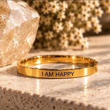 Load image into Gallery viewer, Gold affirmation ring engraved 'I am happy' with sunlit dried flowers - Let's Jam, Camden Market London