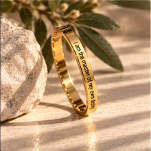 Load image into Gallery viewer, Gold affirmation ring styled with a stone and green leaves in warm sunlight - Let's Jam, Camden Market