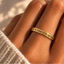 Load image into Gallery viewer, Hand wearing the gold 'I am the master of my own destiny' affirmation ring - Let's Jam jewellery, Camden Market