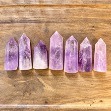 Load image into Gallery viewer, Seven amethyst pointy towers lined up on wood - Let's Jam, Camden Town London
