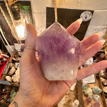 Load image into Gallery viewer, Side view of the cut base amethyst tower showing its height - Let's Jam, Camden Market London