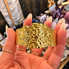 Load image into Gallery viewer, Wide textured gold statement cuff held in the hand - Let's Jam jewellery, Camden Market