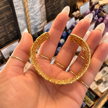 Load image into Gallery viewer, Wide gold statement cuff laid open in the palm - Let's Jam jewellery, Camden Town London