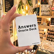 Load image into Gallery viewer, Answers Oracle Deck box held in the hand in the shop - Let's Jam, Camden Market
