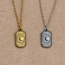 Load image into Gallery viewer, Gold and silver crescent moon tag pendants side by side - Let's Jam, Camden Market, London