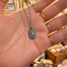 Load image into Gallery viewer, Silver bright moon tag pendant held in the hand - Let's Jam jewellery, Camden Market
