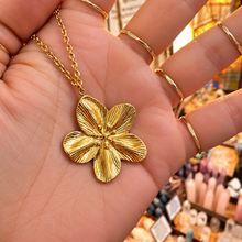 Load image into Gallery viewer, Gold cherry blossom flower pendant held in the hand - Let's Jam, Camden Town