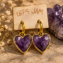 Load image into Gallery viewer, Amethyst crystal heart earrings on a Let's Jam card with an amethyst cluster behind - Let's Jam, Camden Market