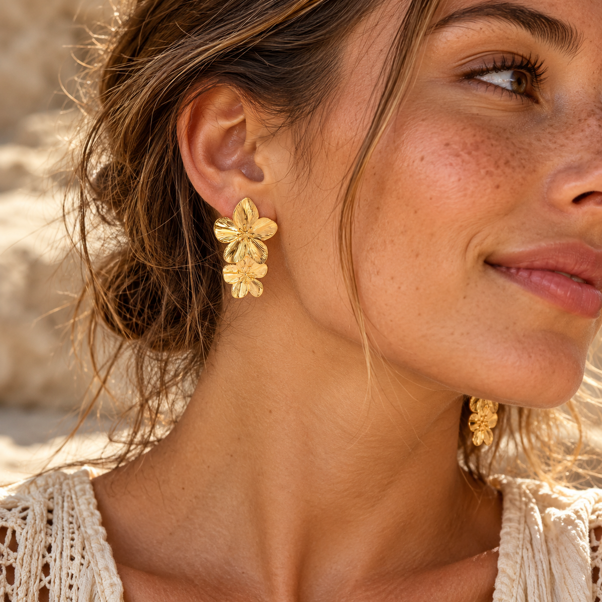 Double Flora gold flower earrings worn, side profile in the sun - Let's Jam, Camden Market, London