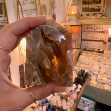 Load image into Gallery viewer, Druzy agate tower number one held in the hand to show its size - Let's Jam, Camden Town London