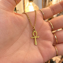 Load image into Gallery viewer, Gold ankh pendant on a chain held in the palm of the hand - Let's Jam jewellery, Camden Market, London