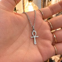 Load image into Gallery viewer, Silver ankh pendant on a chain held in the palm of the hand - Let's Jam, Camden Market