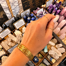 Load image into Gallery viewer, Gold statement cuff of fine crossing bands worn on the wrist - Let's Jam, Camden Town London